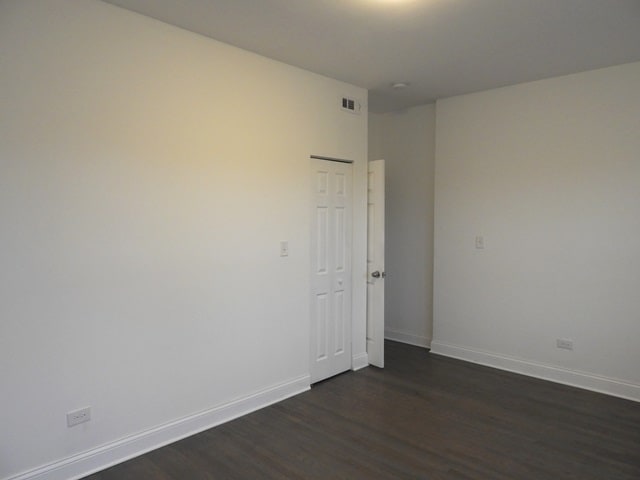 empty room featuring dark hardwood / wood-style floors