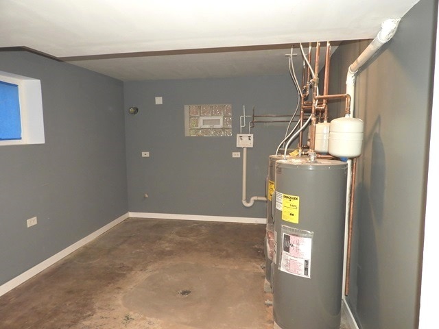 utility room featuring water heater