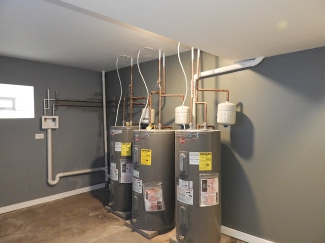 utility room featuring water heater