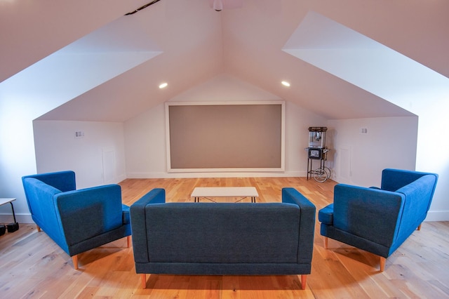 sitting room featuring lofted ceiling and light wood-type flooring