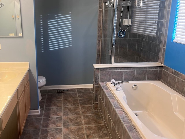 full bathroom with vanity, a garden tub, toilet, baseboards, and tiled shower