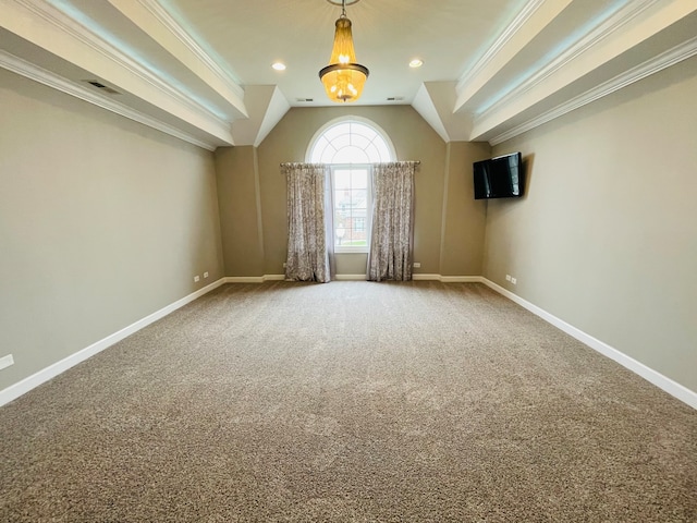 carpeted empty room with lofted ceiling and ornamental molding