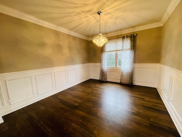 empty room with dark hardwood / wood-style floors, an inviting chandelier, and crown molding