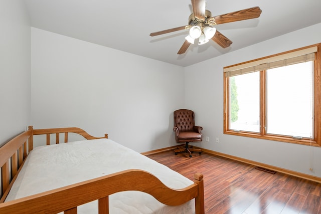 bedroom with hardwood / wood-style flooring and ceiling fan