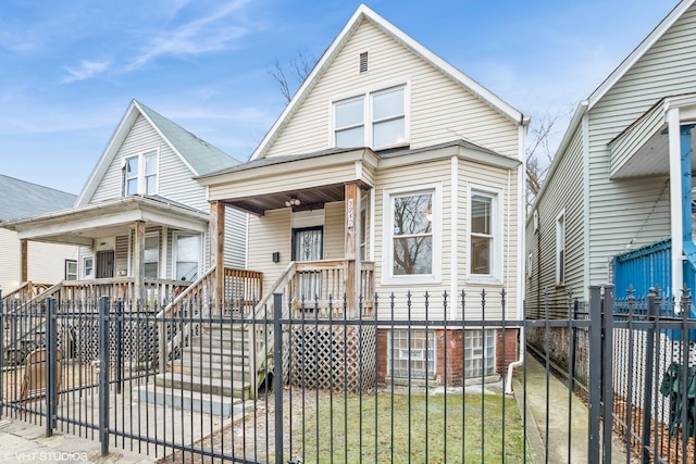 view of front of house featuring a fenced front yard and a porch