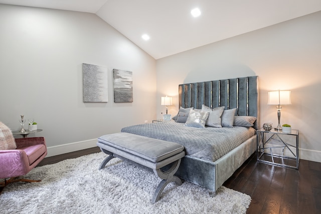 bedroom featuring dark hardwood / wood-style flooring and vaulted ceiling