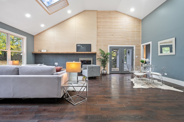 living room featuring a skylight, dark hardwood / wood-style flooring, and french doors