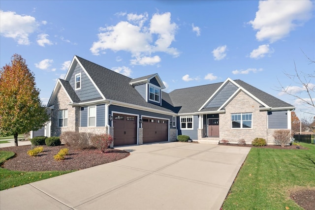 view of front of property featuring a garage and a front lawn