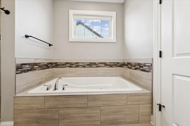 bathroom with tiled bath