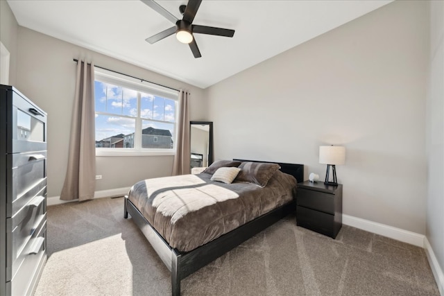 carpeted bedroom with ceiling fan and lofted ceiling