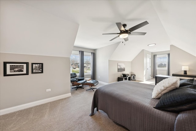 carpeted bedroom featuring multiple windows, ceiling fan, and vaulted ceiling