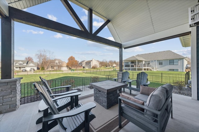 view of patio featuring an outdoor living space with a fire pit