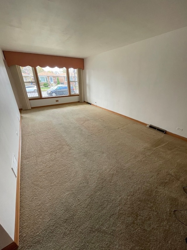 unfurnished room with carpet flooring