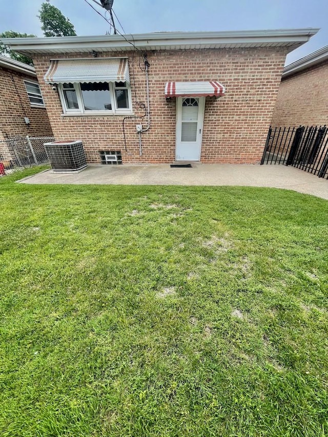 10519 S S Ave E, Chicago, IL 60617 - rear view of house featuring brick siding and a patio