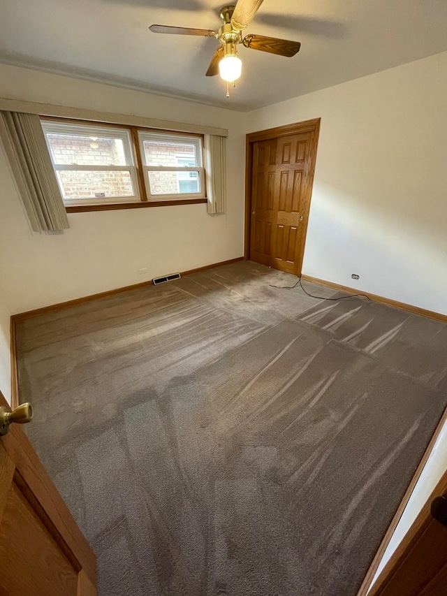 unfurnished bedroom with carpet floors and ceiling fan