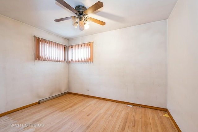 spare room with ceiling fan and light hardwood / wood-style flooring