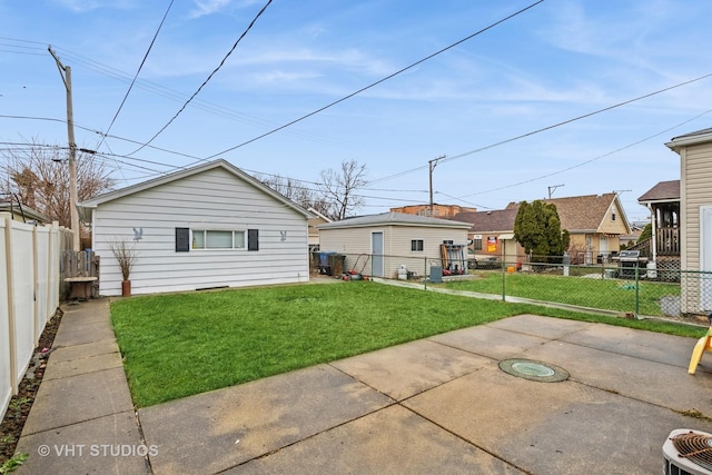 rear view of house featuring a yard