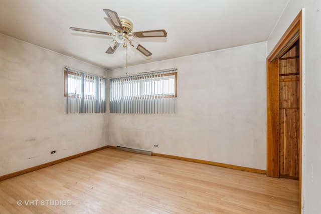 spare room featuring ceiling fan and light hardwood / wood-style floors