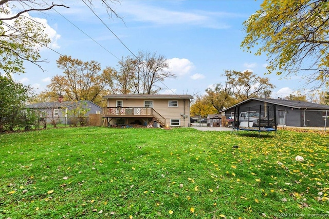 15323 Cherry Ln, Markham, IL 60428 - rear view of property with a trampoline, a deck, stairs, and a patio area