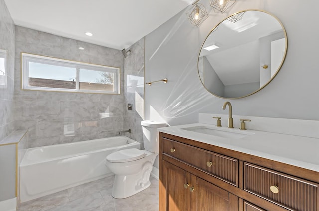 full bathroom with vanity, toilet, and tiled shower / bath