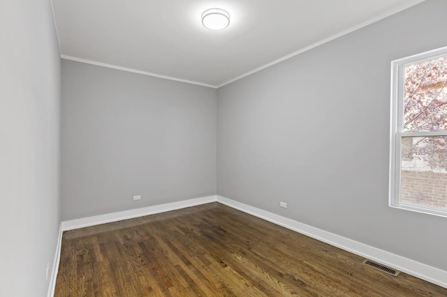 unfurnished room with dark hardwood / wood-style floors and crown molding