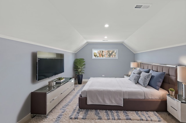 bedroom with carpet flooring and vaulted ceiling