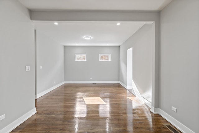 unfurnished room featuring dark hardwood / wood-style flooring