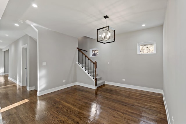 interior space with a chandelier and hardwood / wood-style flooring