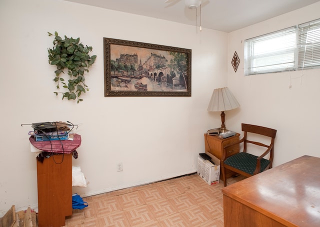 office with light parquet flooring and ceiling fan