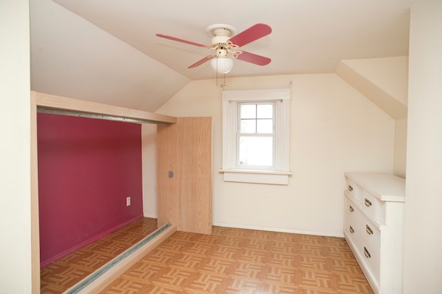 bonus room featuring ceiling fan, lofted ceiling, and light parquet flooring