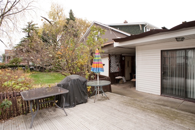 wooden deck featuring area for grilling