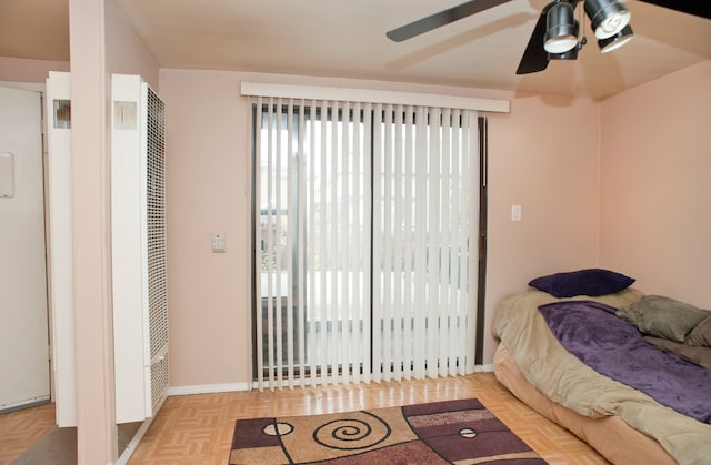 bedroom featuring ceiling fan and light parquet floors