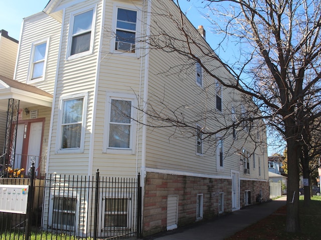 view of side of home with cooling unit