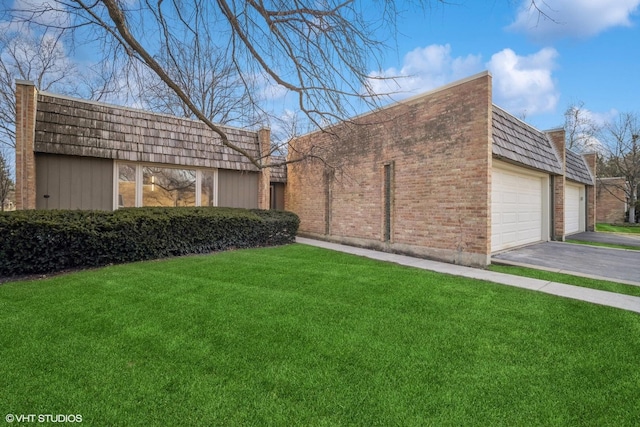 exterior space with a garage and a yard