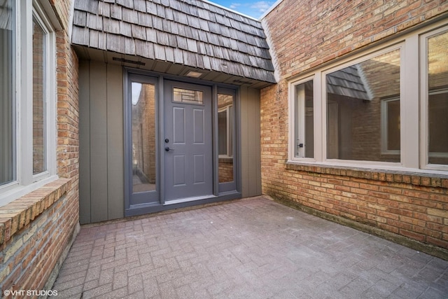 entrance to property with a patio area