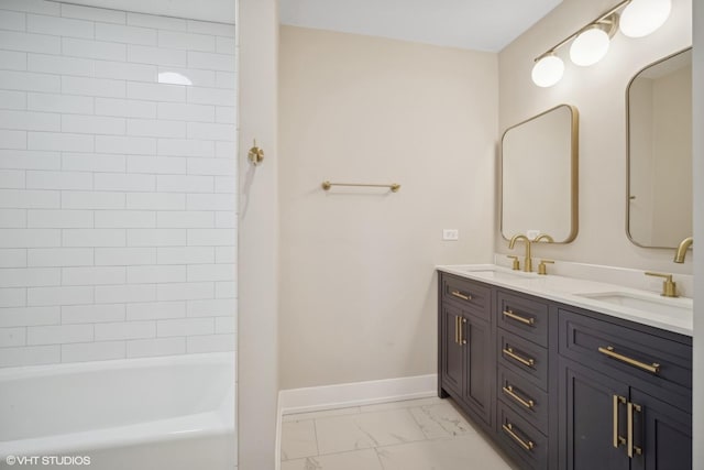 bathroom with vanity and tiled shower / bath combo