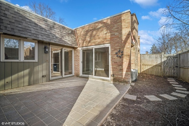 back of property featuring a patio