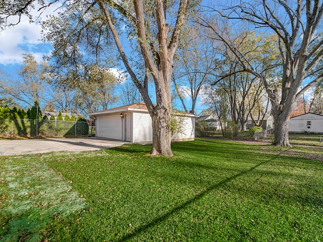 exterior space featuring a garage and a front lawn