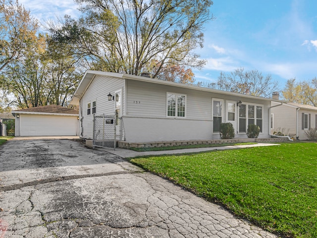 view of front of home with a front yard and a garage