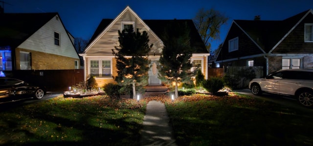 view of front of house with a yard