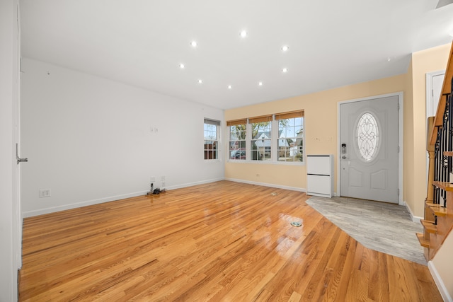 entrance foyer with light hardwood / wood-style flooring