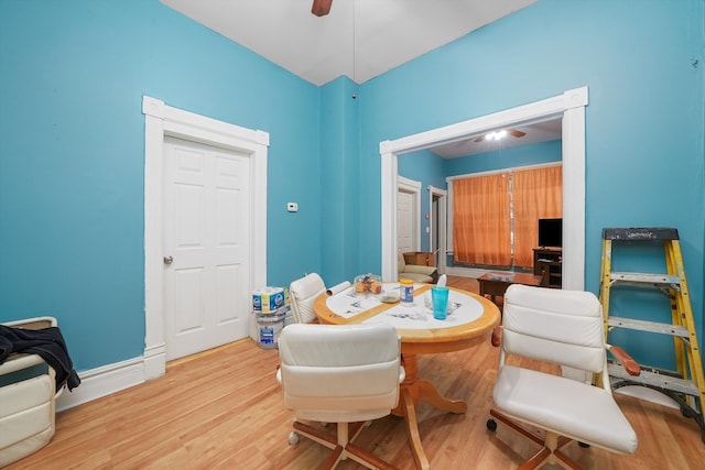 sitting room with ceiling fan and light wood-type flooring