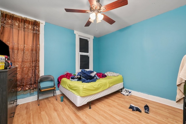 bedroom featuring ceiling fan and light hardwood / wood-style flooring