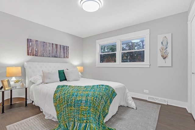 bedroom with hardwood / wood-style floors