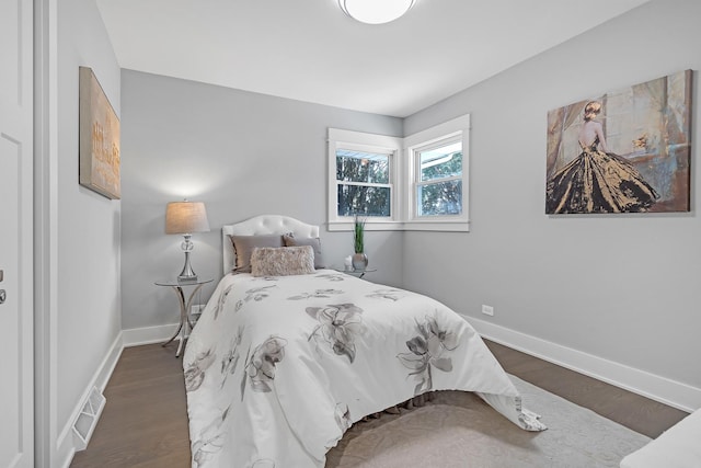 bedroom featuring dark hardwood / wood-style floors