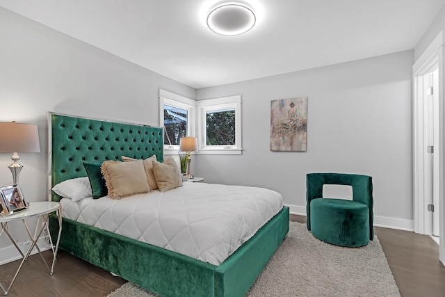 bedroom featuring dark hardwood / wood-style flooring