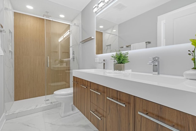 bathroom with vanity, toilet, and walk in shower