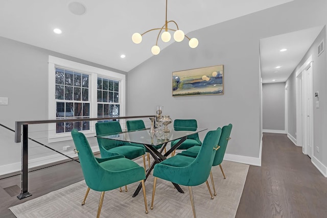 dining space featuring lofted ceiling and hardwood / wood-style floors