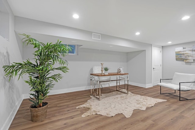 living area with wood-type flooring