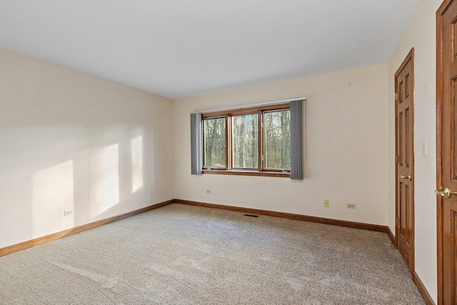 empty room featuring carpet flooring